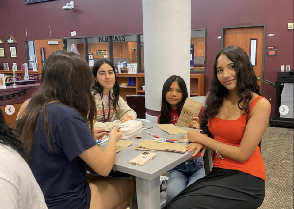students making lunch bags